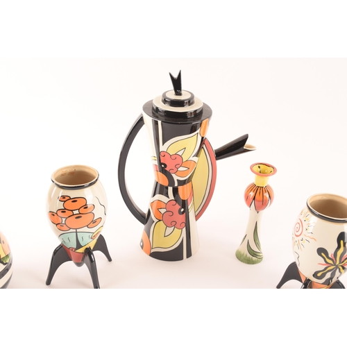 77 - After Clarice Cliff; a collection of ceramics comprising a large and impressive coffee pot, together... 