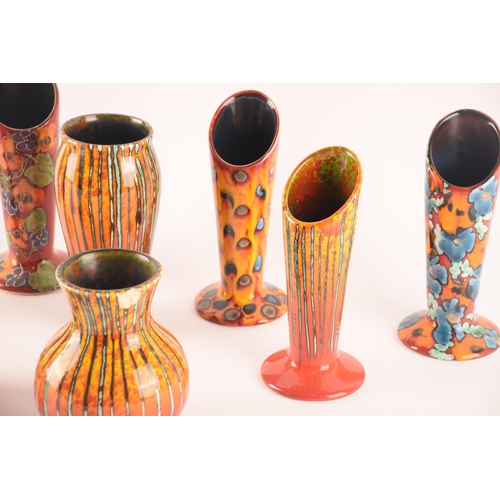 80 - Anita Harris; a collection of ceramics comprising six vases of the same size and shape, and a furthe... 