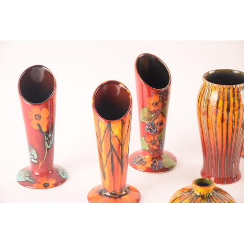 80 - Anita Harris; a collection of ceramics comprising six vases of the same size and shape, and a furthe... 