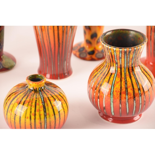 80 - Anita Harris; a collection of ceramics comprising six vases of the same size and shape, and a furthe... 