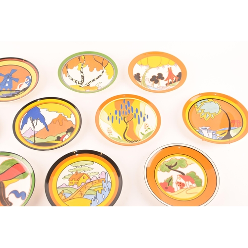 90 - After Clarice Cliff; a collection of ten Wedgwood decorative plates comprising four from the 'World ... 