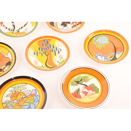 90 - After Clarice Cliff; a collection of ten Wedgwood decorative plates comprising four from the 'World ... 