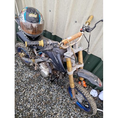 46 - Pit bike and helmet