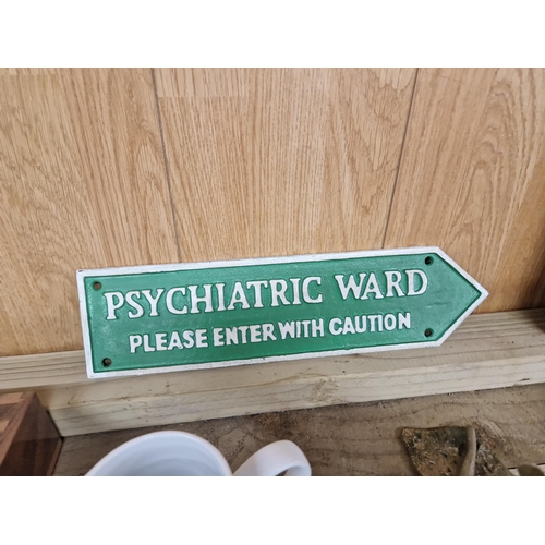 Cast psychiatric ward sign
