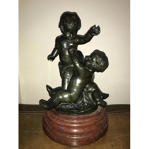 1057 - Bronze group - after Michael Clodion 1738-1814, 3 cherubs on marble base, signed. 30cms h.