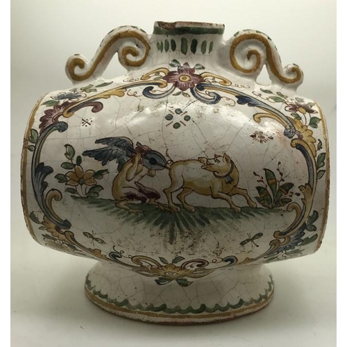 106 - A faience barrel shape spirit flask with polychrome decoration. Marked to the base with script F. 15... 