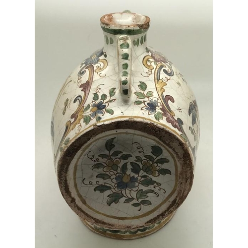 106 - A faience barrel shape spirit flask with polychrome decoration. Marked to the base with script F. 15... 