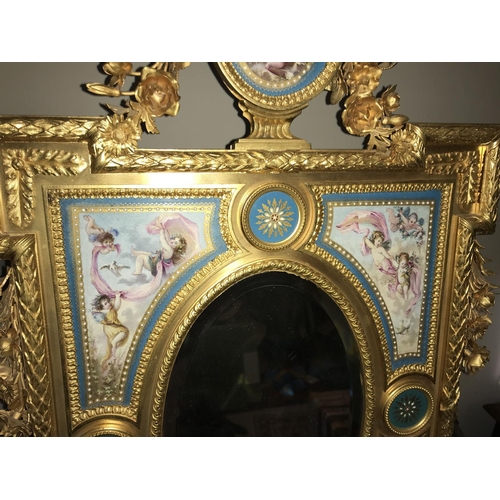 1063 - Porcelain and gilt metal decorative Sevres style table mirror. Oval bevel edged mirror surrounded by... 
