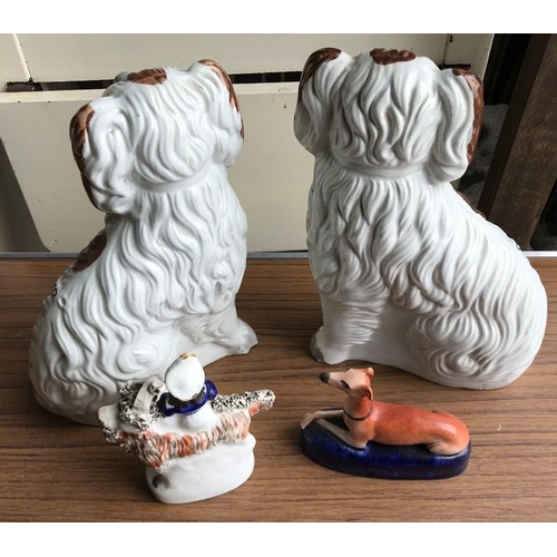 111 - Staffordshire pottery pair of Spaniel dogs, 25cms h together with a small Staffordshire figure of a ... 