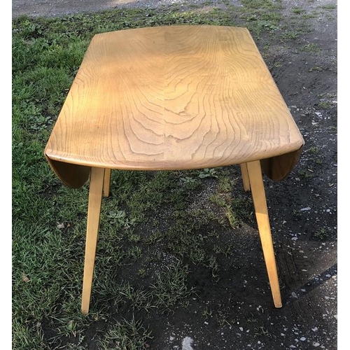 1364 - Ercol oval topped drop leaf table on tapered legs. 125 w open x 114cms, 72cms h.