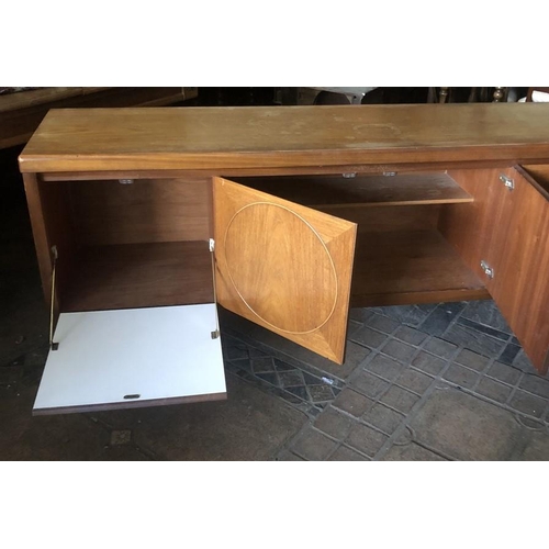 1365 - Mid century teak sideboard, circular panel doors, 3 drawers. 183 w x 45 d x 78cms h.