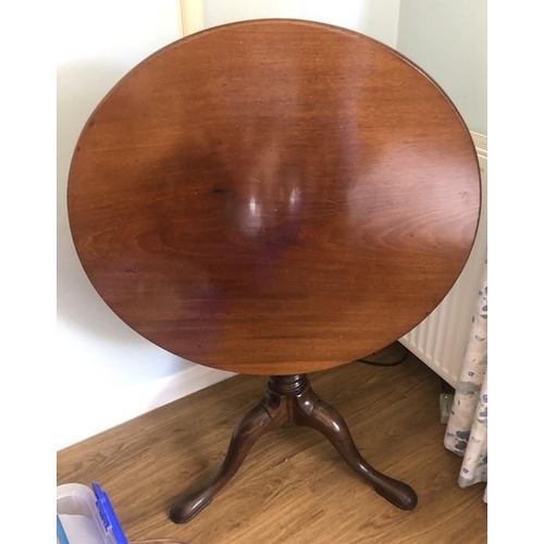 1368 - A mahogany 19thC tip top tripod table on gun barrel stalk and tripod base. 76cms d.