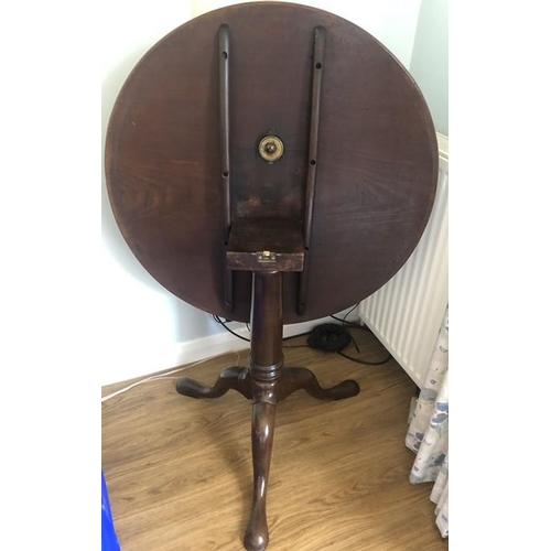 1368 - A mahogany 19thC tip top tripod table on gun barrel stalk and tripod base. 76cms d.