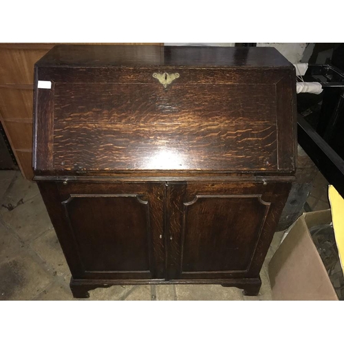 1374 - An 18thC oak bureau, fitted interior, cupboard base on bracket feet. 79 w x 43 d x 95cms h.