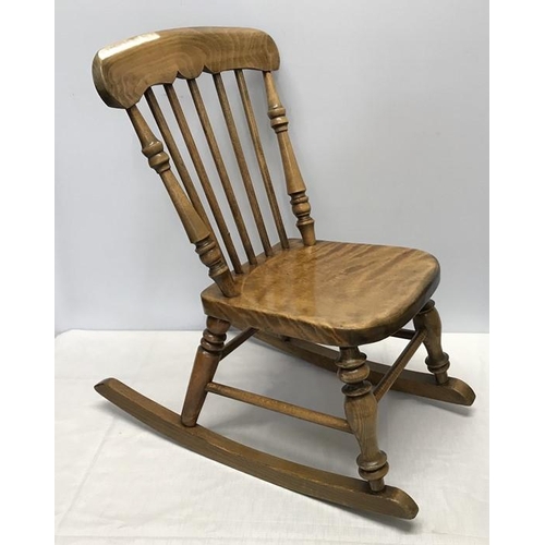 1375 - A child's stick back rocking chair height to seat 29cm, height to back 59cm and width of seat 28cm.