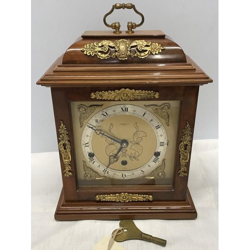 1378 - Mahogany cased Elliot mantle clock with Westminster chime and brass decoration. Carmichaels of Hull.... 