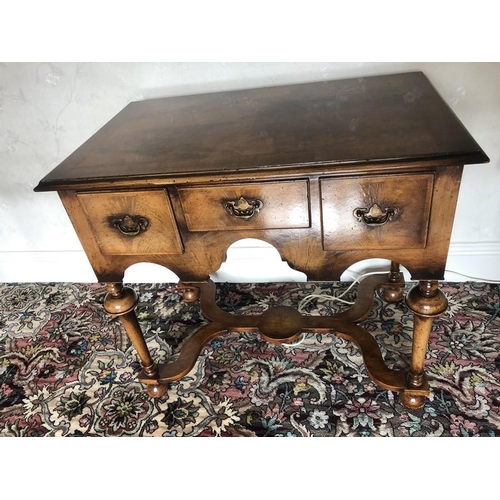 1387 - A good quality walnut reproduction table with cross stretcher base.