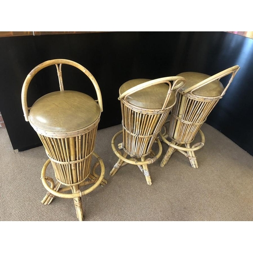 1388 - Three vintage cane barstools.