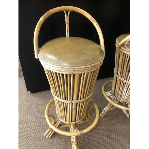 1388 - Three vintage cane barstools.