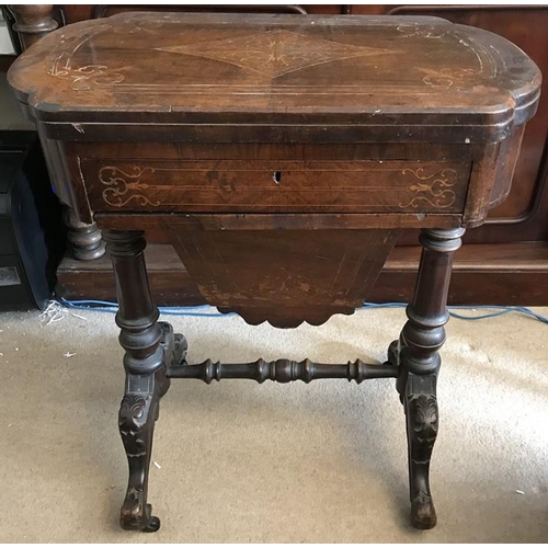 1395 - A 19thC walnut work and games table. 60 x 40 x 75cms h.