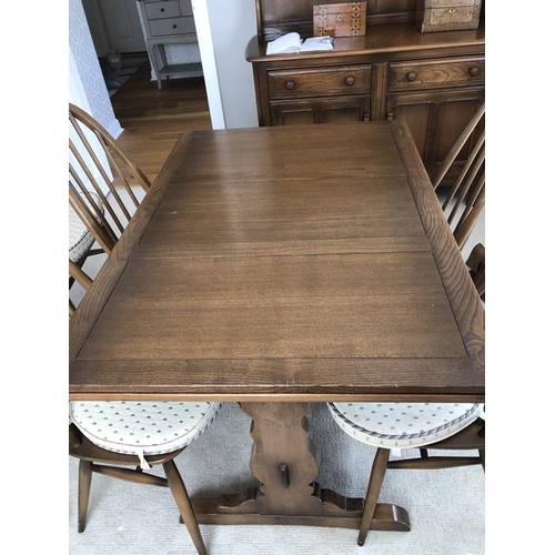 1401 - Ercol draw leaf dining table.