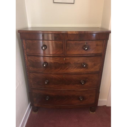 1409 - A 19thC mahogany bowfront chest of drawers, wooden knobs inset with mother of pearl.