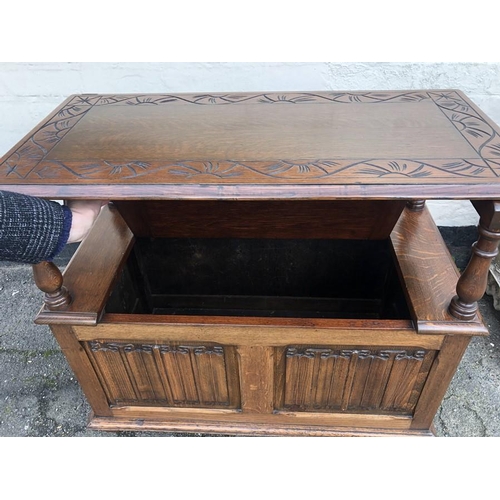 1415 - Oak monks bench with linen fold panels to front. 89 l x 43 w x 72.5cms.