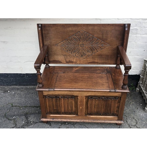 1415 - Oak monks bench with linen fold panels to front. 89 l x 43 w x 72.5cms.