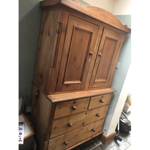 1421 - Pine chest of drawers, two short over two long with cupboard above. 199cm h x 116cm w x 53cm d.