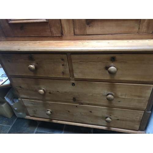 1421 - Pine chest of drawers, two short over two long with cupboard above. 199cm h x 116cm w x 53cm d.