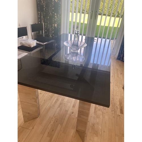 1428 - Modern smoked glass dining table with chrome legs, Italian design. Size 180 x 100cms with matching s... 