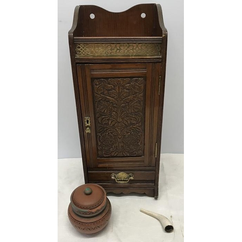 1429 - Oak smokers cabinet, carved door panel, brass gallery and fittings. Stoneware tobacco jar with chipp... 