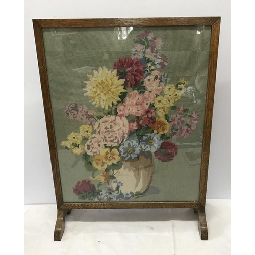 1430 - Oak framed firescrren with woolwork panel floral decoration. 67 h x 50cms w.