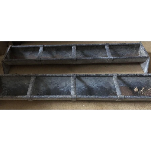 1438 - Two galvanised metal feeding troughs. 88 x 28cms.