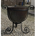Copper bowl planter on a wrought metal stand 46cm h.