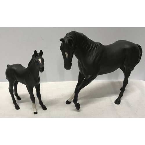 24 - Beswick black horse and foal, 18cms h and 15.5cms , matt finish glaze.