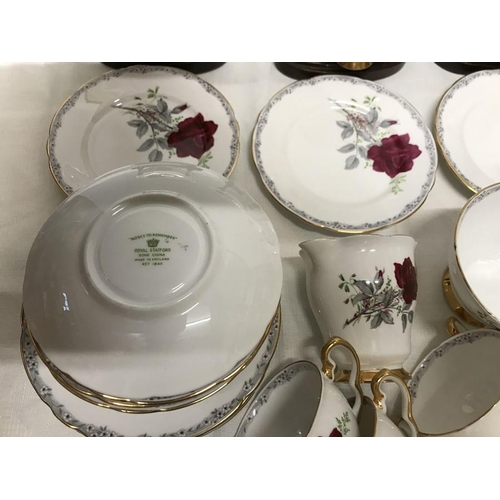 26 - Royal Staffordshire tea service ''Roses to Remember'' teapot, large plate, milk, sugar bowl, 12 cups... 