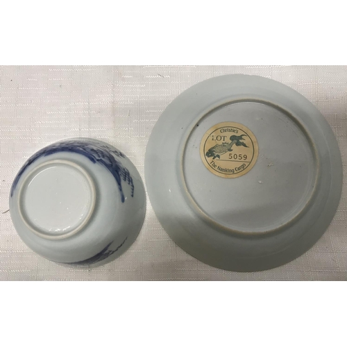 30 - Nanking cargo Chinese blue and white Saki cup and saucer, saucer 11.5cms w, cup 4cms h with chips to... 
