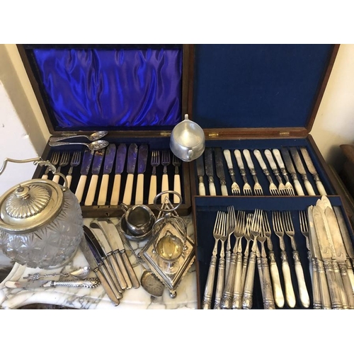 455 - A quantity of mainly 19thC plated cutlery, biscuit barrel, toast rack, butter knives, dessert knives... 