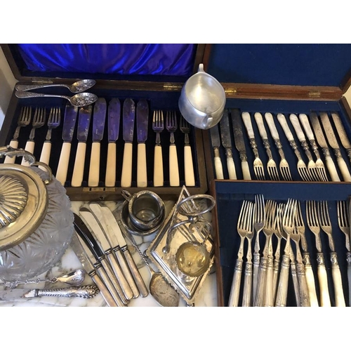 455 - A quantity of mainly 19thC plated cutlery, biscuit barrel, toast rack, butter knives, dessert knives... 