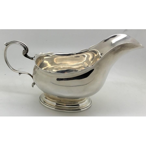 471 - Silver cream jug, Birmingham, maker William Hutton & Sons, date mark rubbed. 217.8gms.