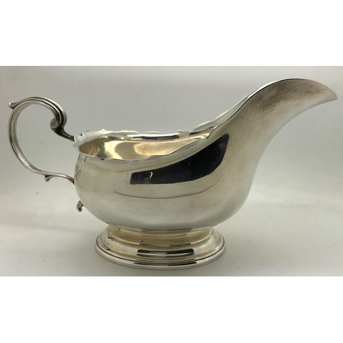 471 - Silver cream jug, Birmingham, maker William Hutton & Sons, date mark rubbed. 217.8gms.