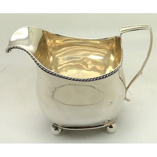 474 - George III silver cream jug, London 1812, maker Peter and William Bateman. 164.9gms with gadroon bor... 