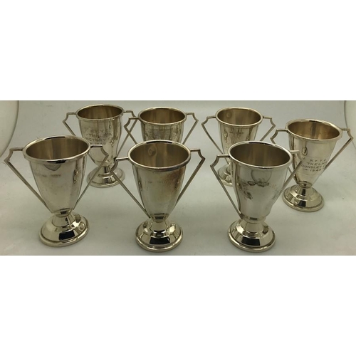 475 - Seven hallmarked silver trophies, 7cms h, two inscribed R.Y.Y.C Thelma Victory cup 1949 and R.Y.Y.C.... 