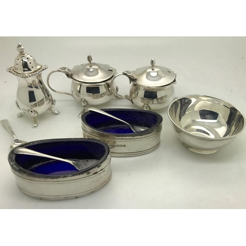 478 - Various hallmarked silver salts, pepperettes and mustards, some with blue glass liners and 3 spoons,... 