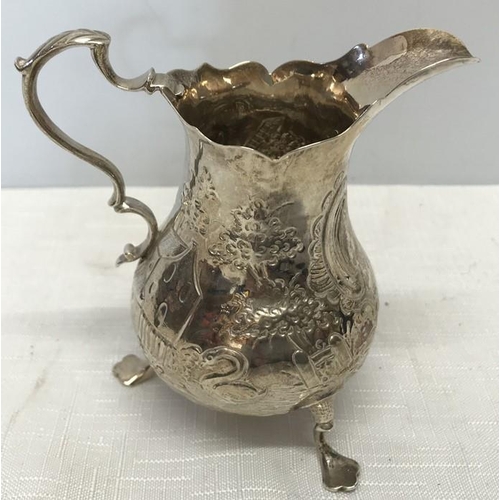 491 - Hallmarked silver jug, 11cms h, embossed decoration with windmill, maker E.C possibly Ebenezer Coker... 