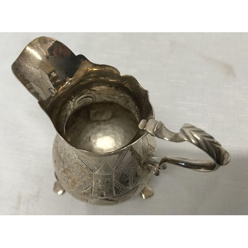 491 - Hallmarked silver jug, 11cms h, embossed decoration with windmill, maker E.C possibly Ebenezer Coker... 