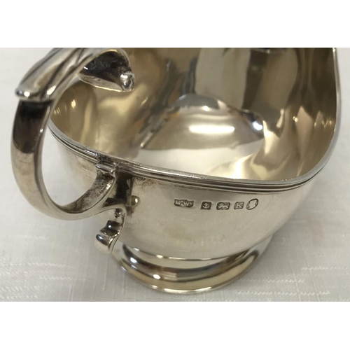 503 - Hallmarked silver sauce boat, Mappin and Webb, Birmingham 1934. 107gm. 9cms h.