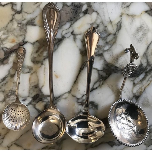 504 - Four various white metal spoons and ladles.