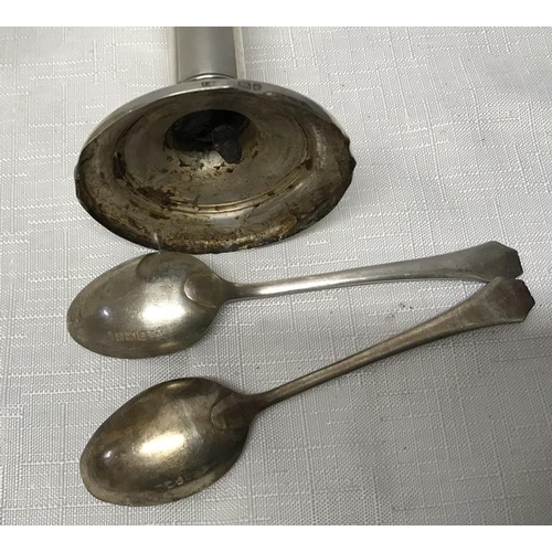 509 - Small silver candlestick and a pair of silver teaspoons, 100gms approx. (no filling to candlestick b... 